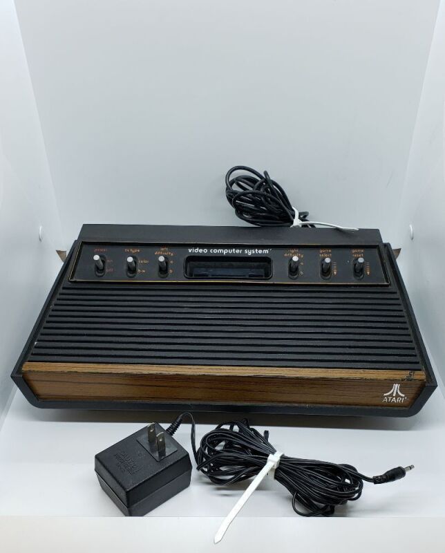 ATARI 2600 SYSTEM W/ 38 GAME CARTS, MANUALS (39) 5 JOYSTICK CONTROLLERS, 1 POINT MASTER CONTROL, 4 PADDLE CONTROLLERS