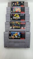 SUPER NES CONSOLE W/ 2 CONTROLLERS + 5 GAMES PUNCHOUT,TOY STORY,JURASSIC PARK, SUPER GHOULS & GHOSTS, KING OF MONSTERS 2 - 4